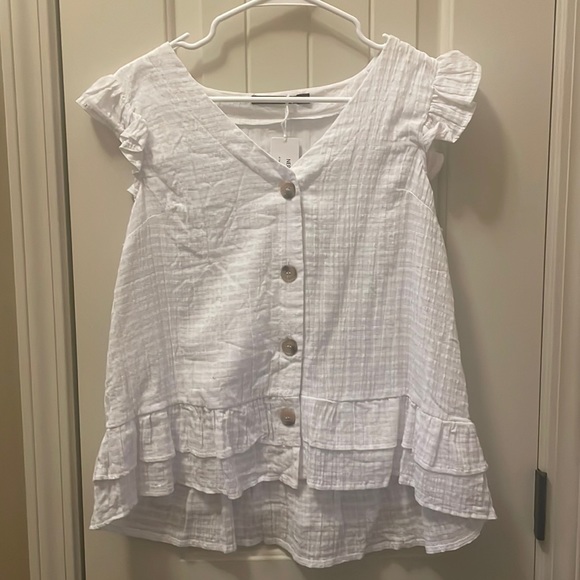 Tops - Women’s white button down blouse with ruffled edge.